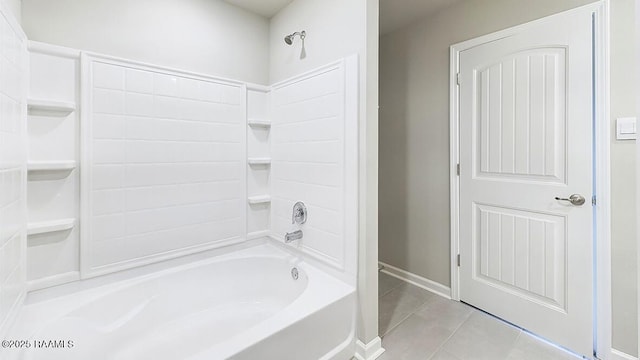 bathroom featuring bathing tub / shower combination and tile patterned flooring