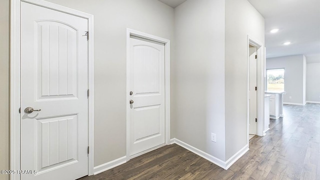 corridor featuring dark hardwood / wood-style flooring