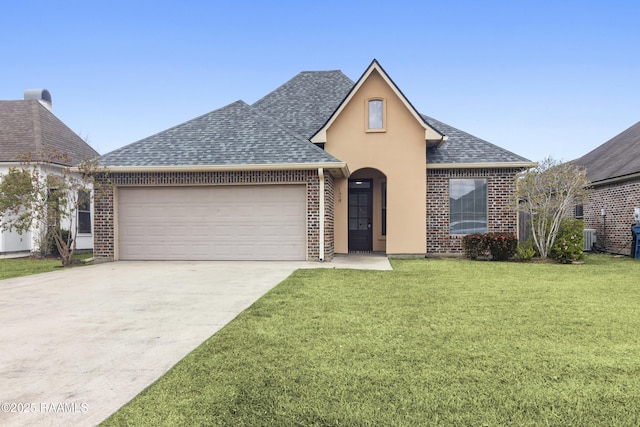 view of front of home featuring a front lawn and a garage