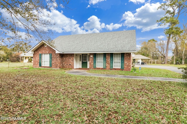 single story home with a front yard