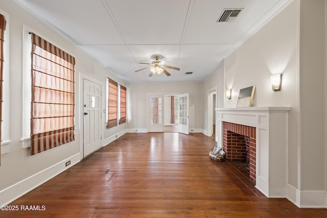 unfurnished living room with ceiling fan, dark hardwood / wood-style flooring, and a fireplace