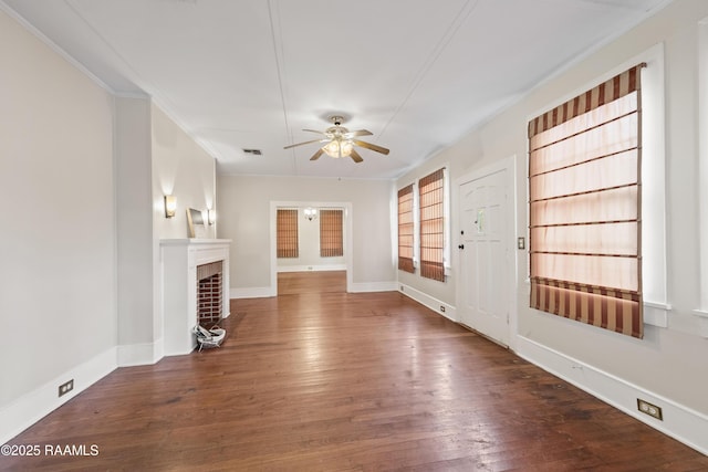 unfurnished living room with ceiling fan, dark hardwood / wood-style flooring, built in features, and ornamental molding