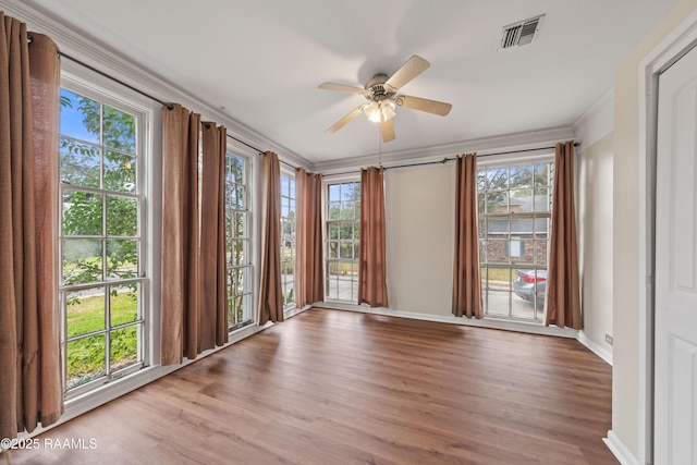 spare room with ceiling fan, crown molding, and light hardwood / wood-style flooring