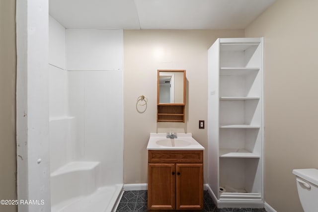 bathroom with toilet and vanity