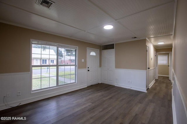 unfurnished room with dark wood-type flooring and a wealth of natural light