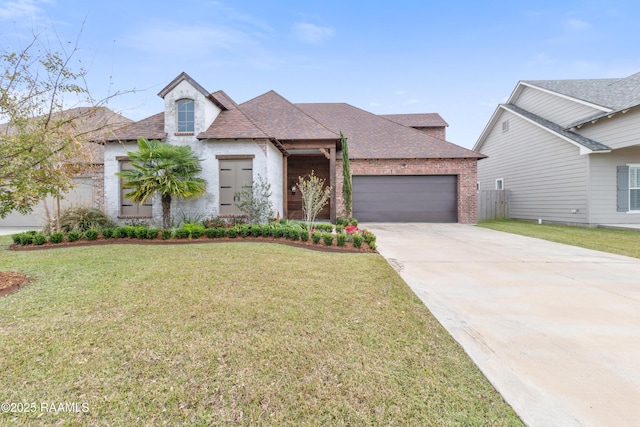 view of front of house featuring a front yard and a garage