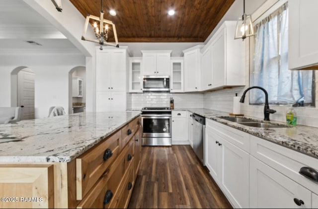 kitchen featuring wood ceiling, stainless steel appliances, hanging light fixtures, sink, and white cabinetry