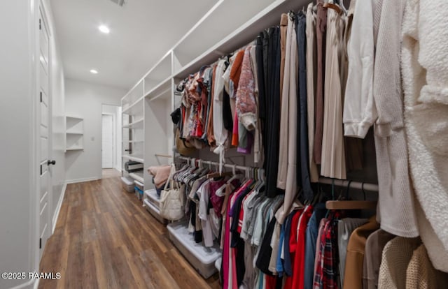 walk in closet featuring dark hardwood / wood-style flooring