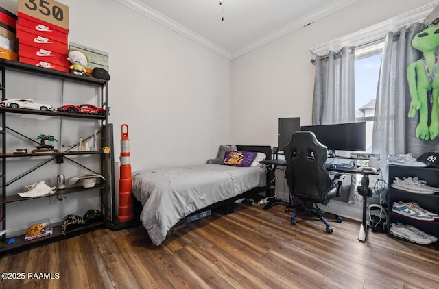 bedroom with ornamental molding, vaulted ceiling, and wood-type flooring