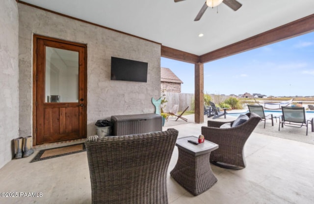 view of patio with ceiling fan and a fenced in pool