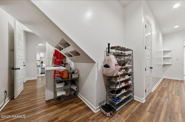 corridor featuring dark hardwood / wood-style flooring