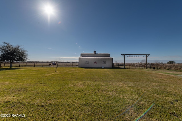 view of yard with a rural view