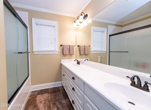 bathroom featuring crown molding, vanity, and combined bath / shower with glass door