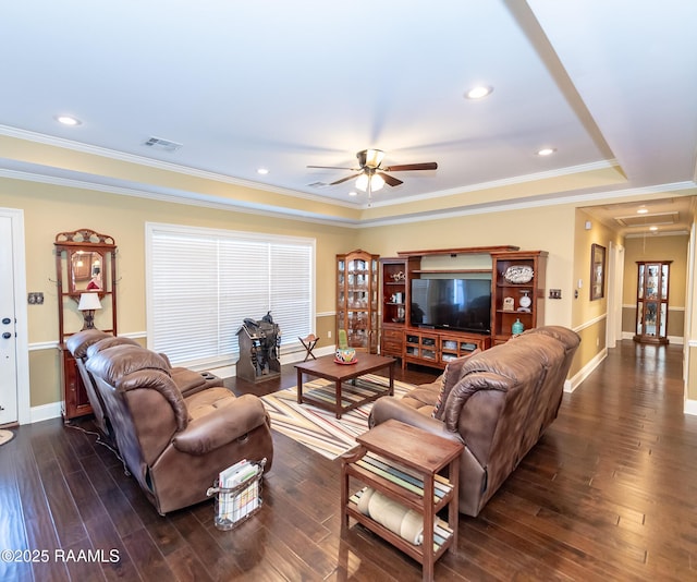 living room with crown molding, ceiling fan, and dark hardwood / wood-style flooring