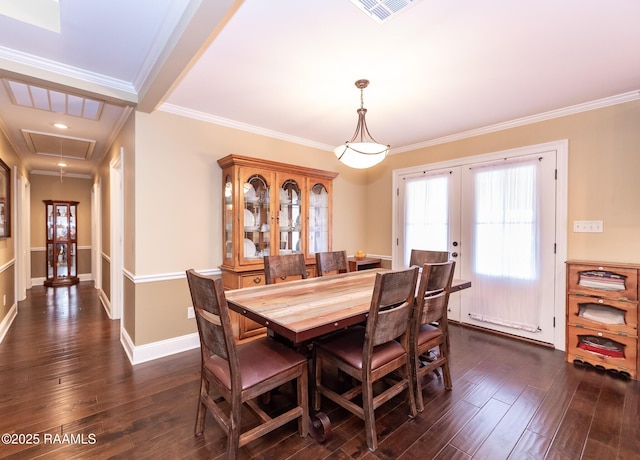 dining room with french doors, dark hardwood / wood-style flooring, and crown molding