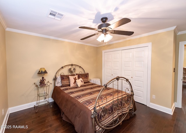 bedroom featuring crown molding, ceiling fan, dark hardwood / wood-style floors, and a closet