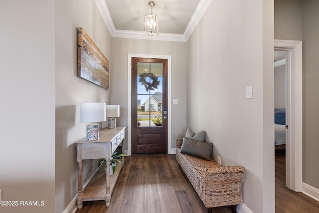 entrance foyer with crown molding and dark hardwood / wood-style floors