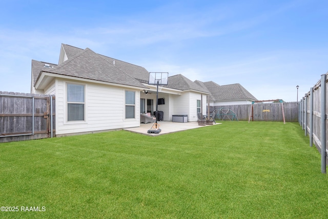 back of property with a patio and a lawn