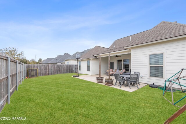 view of yard with a patio area, ceiling fan, and outdoor lounge area