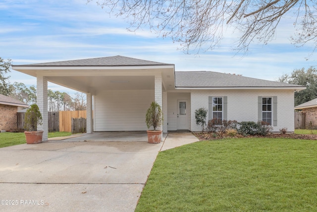 single story home with a front yard and a carport