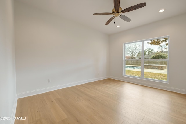 unfurnished room with ceiling fan and light hardwood / wood-style floors