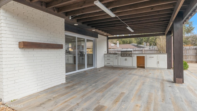 deck with area for grilling and a grill