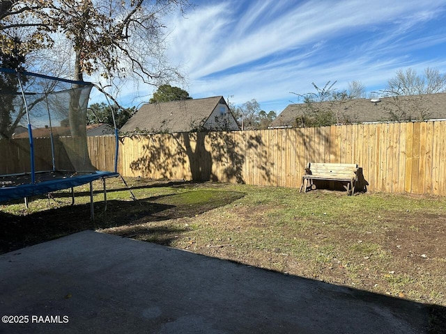 view of yard with a trampoline