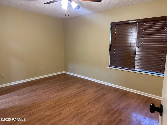 unfurnished room with wood-type flooring, a textured ceiling, and ceiling fan