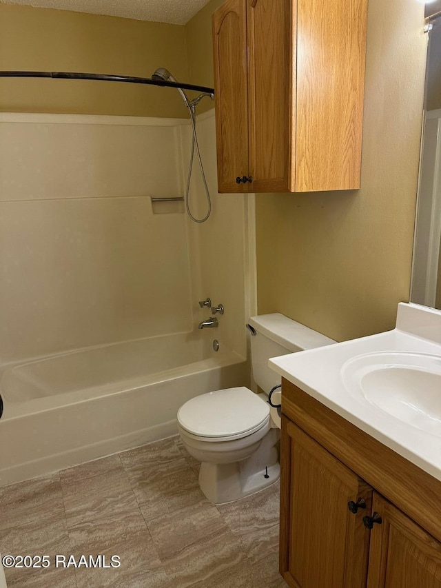 full bathroom featuring vanity, toilet, and shower / washtub combination