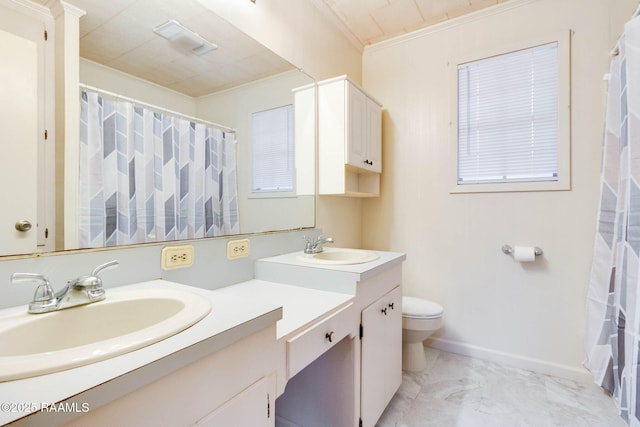 bathroom featuring toilet, ornamental molding, and vanity