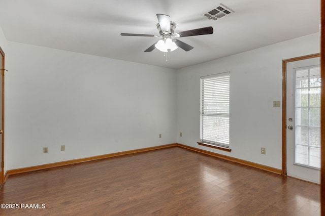 empty room featuring ceiling fan and dark hardwood / wood-style floors