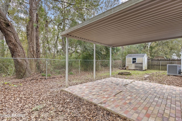 view of patio with central AC unit and a storage unit