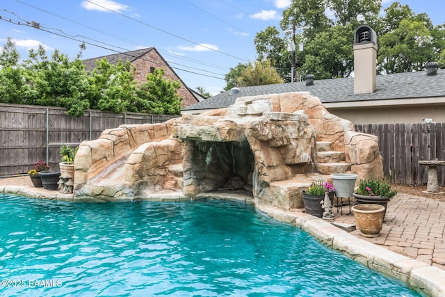 view of pool with pool water feature