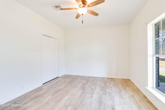 spare room featuring ceiling fan and light hardwood / wood-style flooring