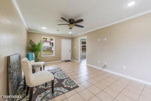 living area featuring ceiling fan, light tile patterned floors, and crown molding