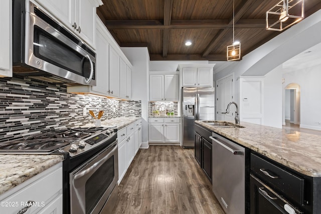 kitchen featuring pendant lighting, sink, white cabinetry, stainless steel appliances, and wooden ceiling