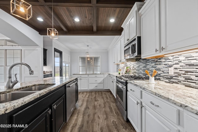 kitchen featuring decorative light fixtures, sink, white cabinetry, stainless steel appliances, and wooden ceiling