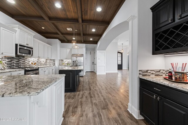 kitchen with a kitchen island, white cabinetry, stainless steel appliances, wooden ceiling, and coffered ceiling