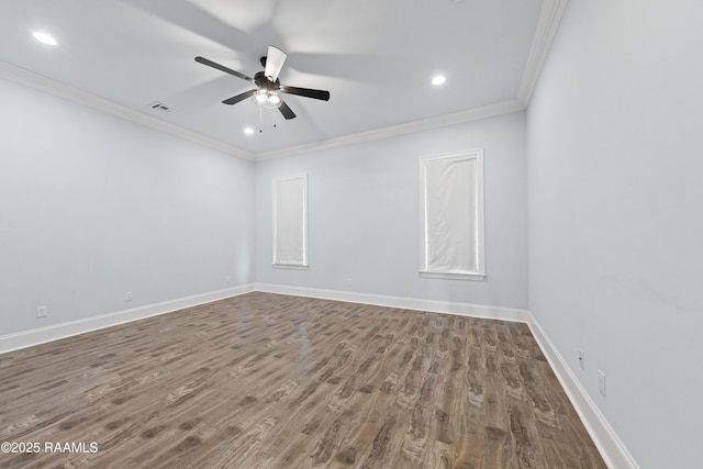 spare room featuring ceiling fan, hardwood / wood-style flooring, and crown molding