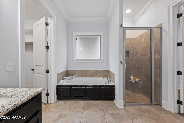 bathroom with vanity, ornamental molding, separate shower and tub, and tile patterned flooring