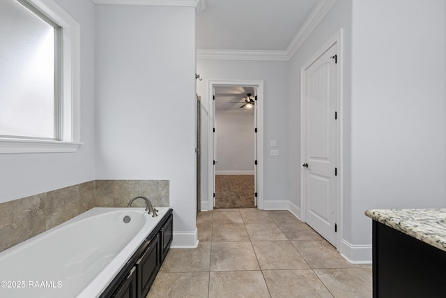 bathroom featuring ceiling fan, a bathtub, tile patterned flooring, crown molding, and vanity