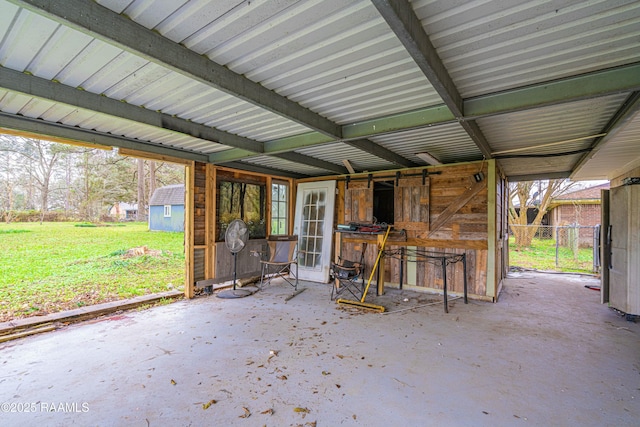 view of patio / terrace featuring a storage shed