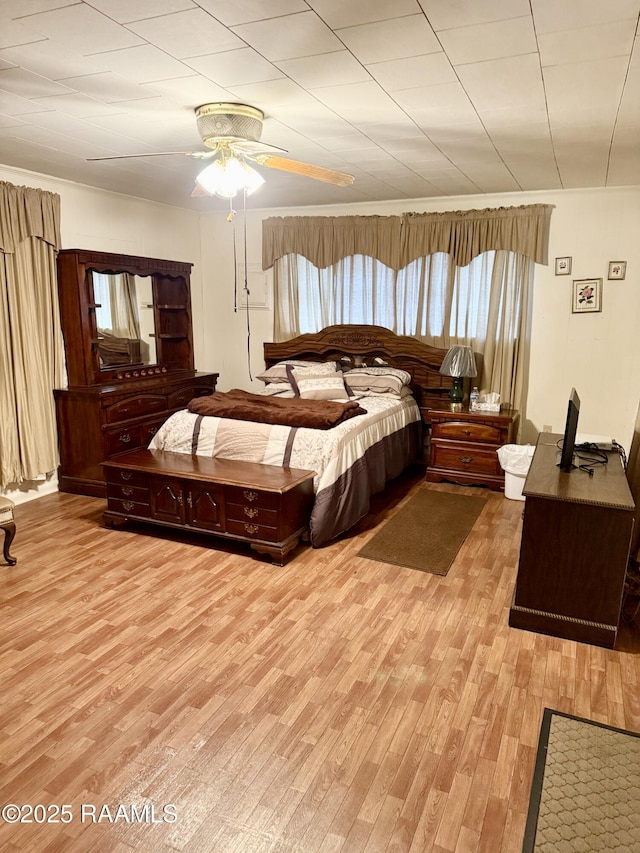 bedroom featuring ceiling fan and light wood-type flooring