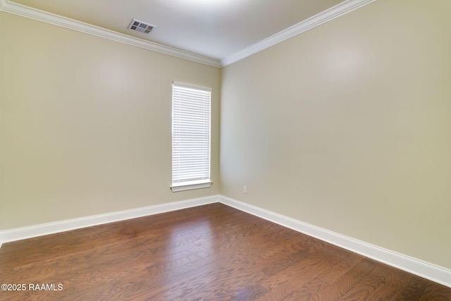 unfurnished room with ornamental molding and dark wood-type flooring