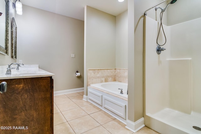 bathroom featuring vanity, tile patterned floors, and plus walk in shower