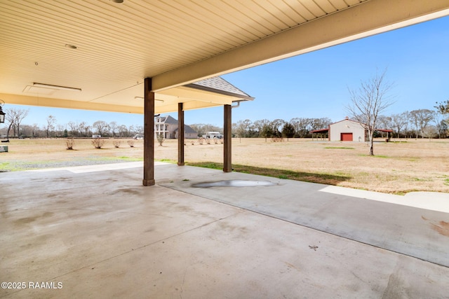 view of patio / terrace with a rural view