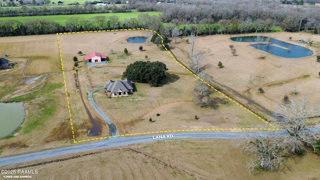 birds eye view of property with a water view and a rural view