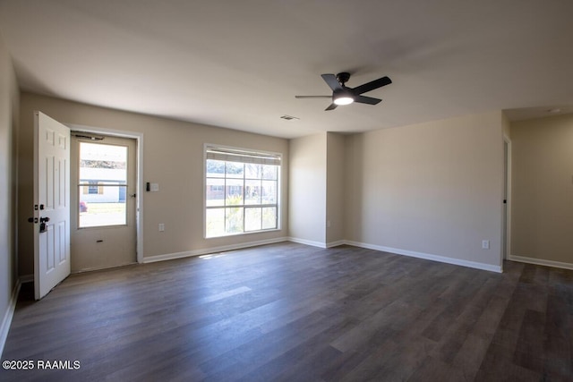 unfurnished room featuring ceiling fan and dark hardwood / wood-style flooring