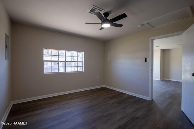 empty room with ceiling fan and dark hardwood / wood-style floors