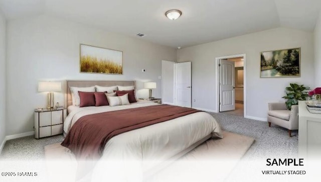 bedroom featuring lofted ceiling and light colored carpet